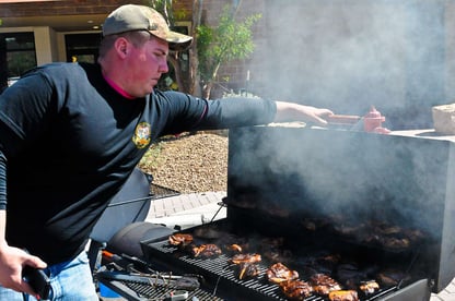 a-competitor-from-the-combat-aviation-brigade-bbq-team-208c32-1600